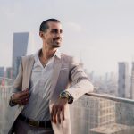 businessman looking out over the city